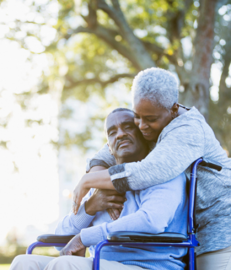 Two_adults_hugging_in_park_840x500.original
